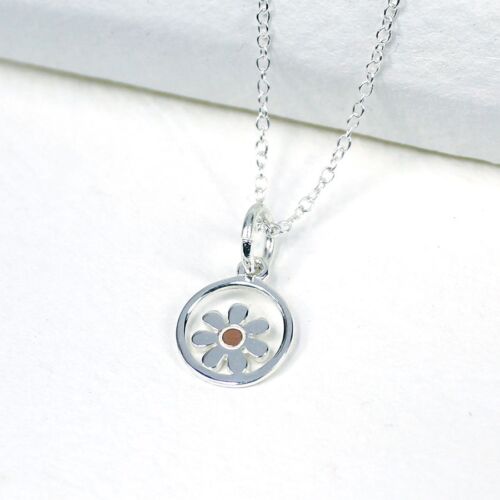 Silver Necklace with dainty flower in centre of a circle . Rose gold centre