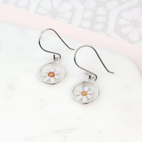 Silver Earrings with dainty flower in centre of a circle . Rose gold centre
