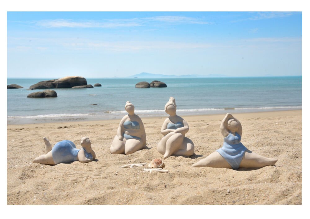 A group of Bating Belle Figurines on the Beach