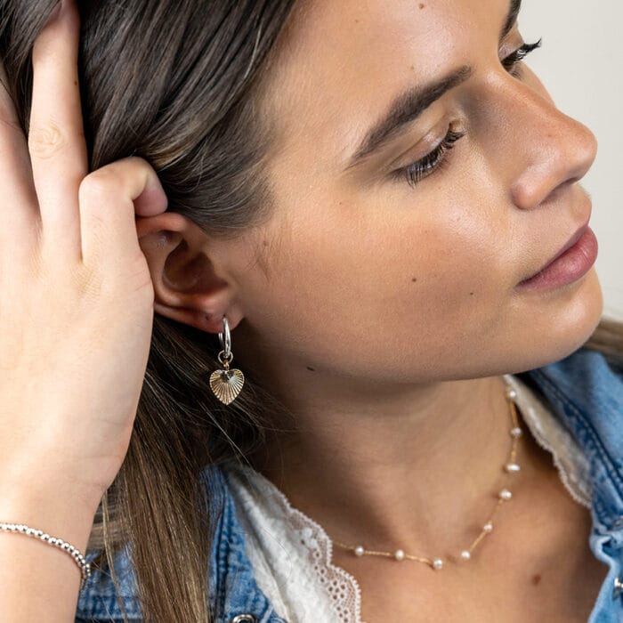 Silver plated hoop and golden embossed heart earrings
