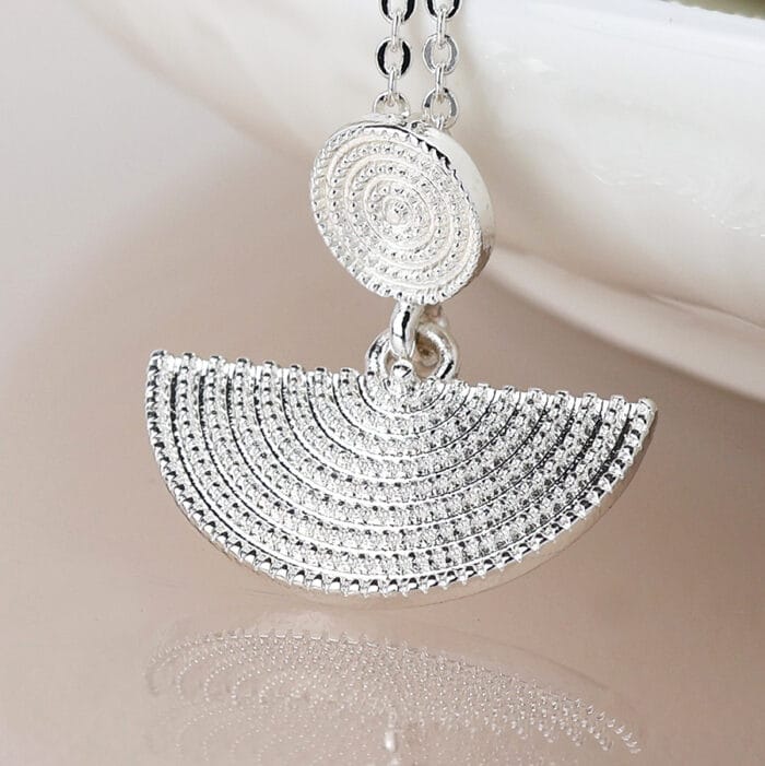Silver plated disc and half moon necklace
