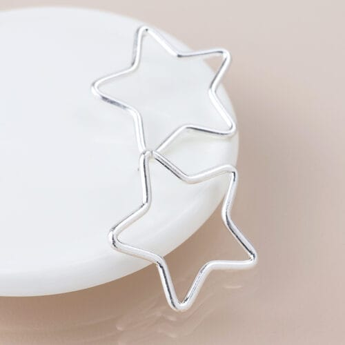 Silver plated open star earrings
